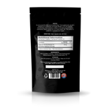 The back of a black stand-up pouch packaging, shown on a white background with a soft reflection.