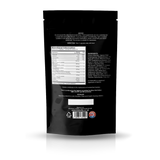 The back of a black stand-up pouch package, showing printed nutrition facts, ingredients, and storage instructions on a clean white background with a soft reflection below.