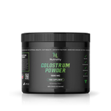 A black plastic tub of Nutrality Colostrum Powder 1500 MG food supplement, featuring a black lid and a black label with green and white text, set against a plain white background with a subtle reflection.