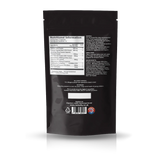 The back of a black resealable stand-up pouch with printed nutrition facts, ingredients, and warning text, shown on a white background with a faint reflection below.