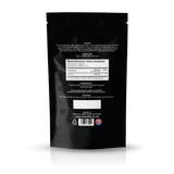 The back of a black stand-up pouch package, showing printed nutritional information, ingredients, storage instructions, and a barcode on a clean white background.